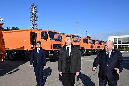 President Ilham Aliyev in Baku carrying household waste