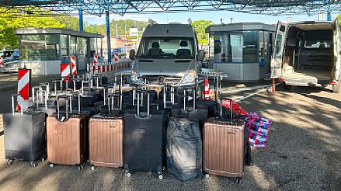 A woman returning from vacation with 55 suitcases -
