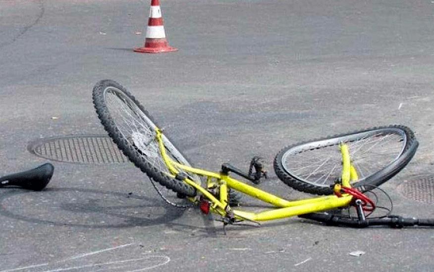 A child riding a bicycle was hit and killed by a car.