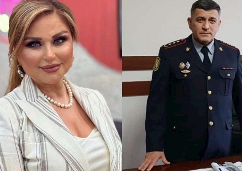 Mələkxanım Eyubova's husband with their grandchild —