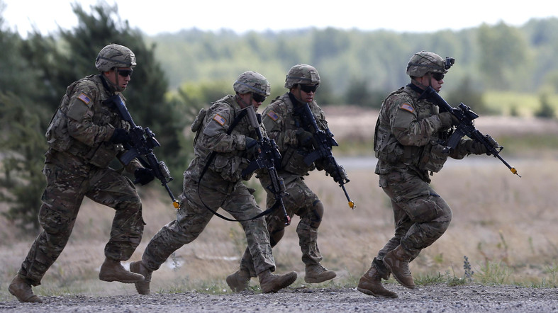 Members of the U.S. Army 173rd Airborne Brigade practice   during the combined Lithuanian-U.S. training exercise at the Gaiziunai Training Area some 110 kms (69 miles) west of the capital Vilnius Lithuania, Tuesday, July 7, 2015. (AP Photo/Mindaugas Kulbis)