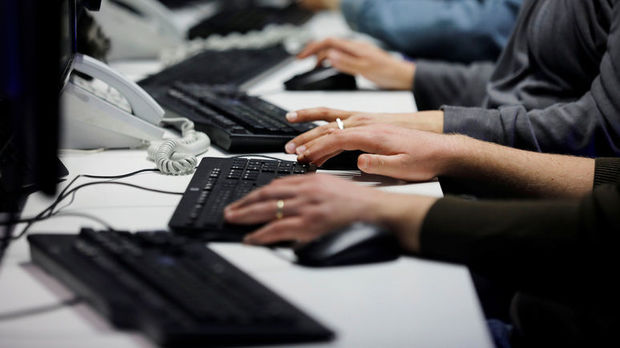 Employees, mostly veterans of military computing units, use keyboards as they work at a cyber hotline facility at Israel's Computer Emergency Response Centre (CERT) in Beersheba, southern Israel February 14, 2019. Picture taken February 14, 2019. REUTERS/Amir Cohen