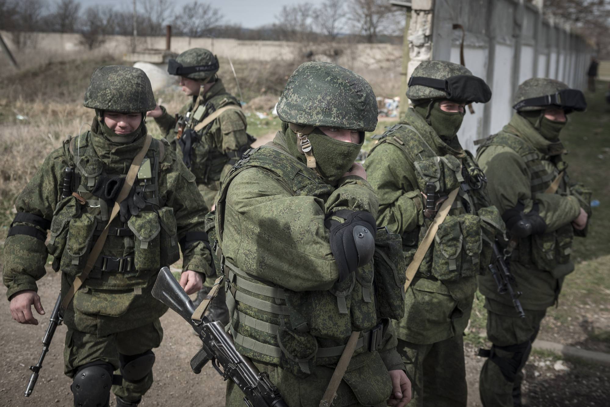FILE -- Unidentified soldiers in Crimea, March 6, 2014. Russia has amassed more troops on the Ukrainian border than at any time since 2014. Western governments are asking: Why now? (Sergey Ponomarev/The New York Times)