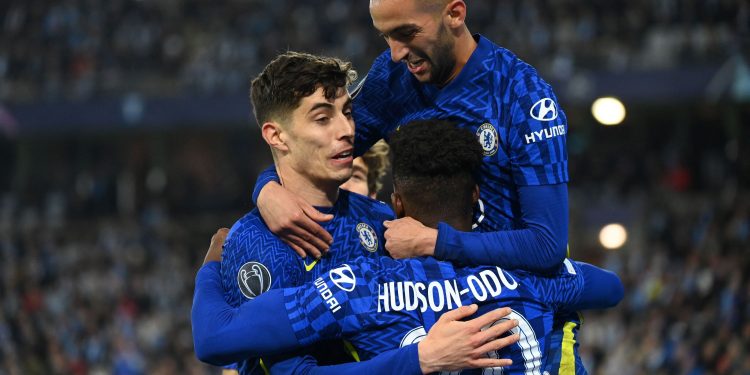 Chelsea's Moroccan midfielder Hakim Ziyech (R) celebrates scoring the opening goal with his teammate Chelsea's German midfielder Kai Havertz (L) and Chelsea's English midfielder Callum Hudson-Odoi (C) during the UEFA Champions League group H football match Malmo FF v Chelsea FC in Malmo, Sweden on November 2, 2021. (Photo by Jonathan NACKSTRAND / AFP) (Photo by JONATHAN NACKSTRAND/AFP via Getty Images)