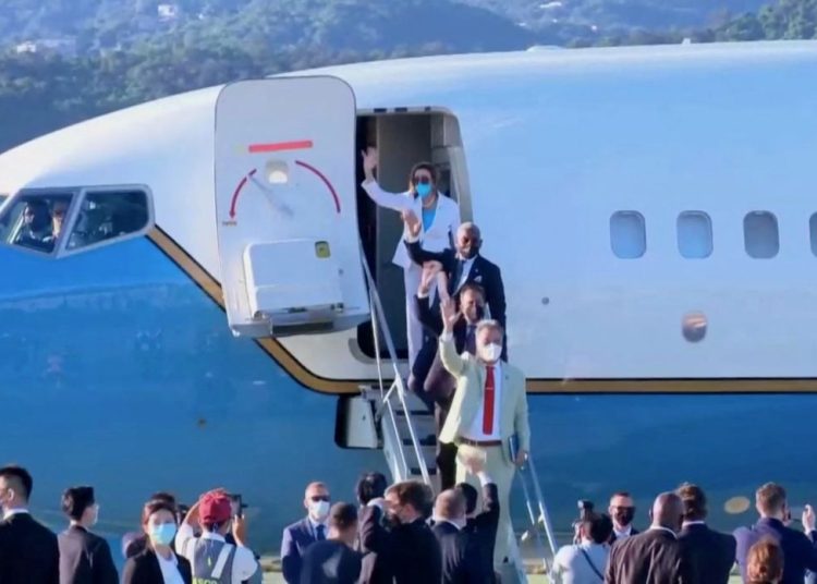 U.S. House of Representatives Speaker Nancy Pelosi waves with other members of the delegation as they board a plane before leaving Taipei Songshan Airport, in Taipei, Taiwan August 3, 2022, in this screengrab taken from video. REUTERS TV/Pool via REUTERS. NO RESALES. NO ARCHIVES.