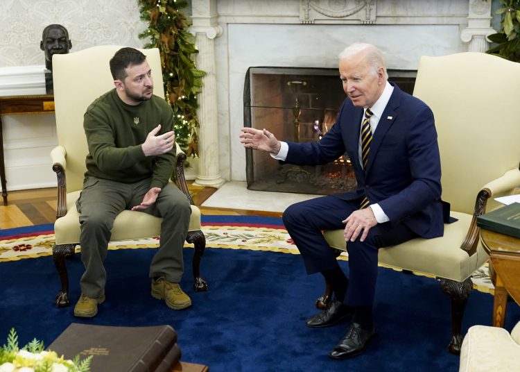 President Joe Biden speaks with Ukrainian President Volodymyr Zelenskyy as they meet in the Oval Office of the White House, Wednesday, Dec. 21, 2022, in Washington. (AP Photo/Patrick Semansky)