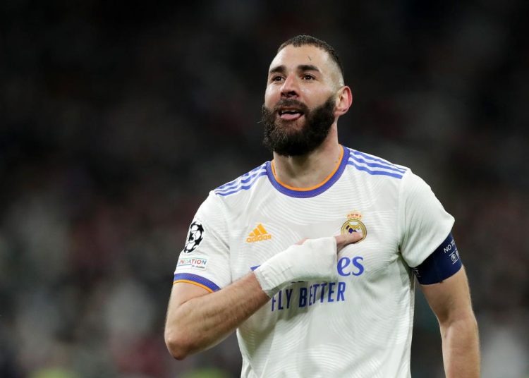 MADRID, SPAIN - MARCH 09: Karim Benzema of Real Madrid celebrates after scoring their team's second goal during the UEFA Champions League Round Of Sixteen Leg Two match between Real Madrid and Paris Saint-Germain at Estadio Santiago Bernabeu on March 09, 2022 in Madrid, Spain. (Photo by Gonzalo Arroyo Moreno/Getty Images)