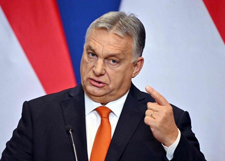 Hungarian Prime Minister Viktor Orban gestures as he addresses an annual press conference in Budapest on December 21, 2022, prior to the government's last meeting of the year 2022.  (Photo by Attila KISBENEDEK / AFP)